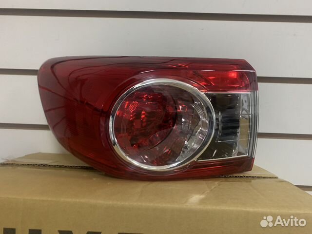 Фонарь задний наружный левый Toyota Corolla E150