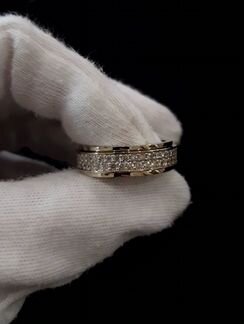 Золотое кольцо с пожвижным центром и бриллиантами